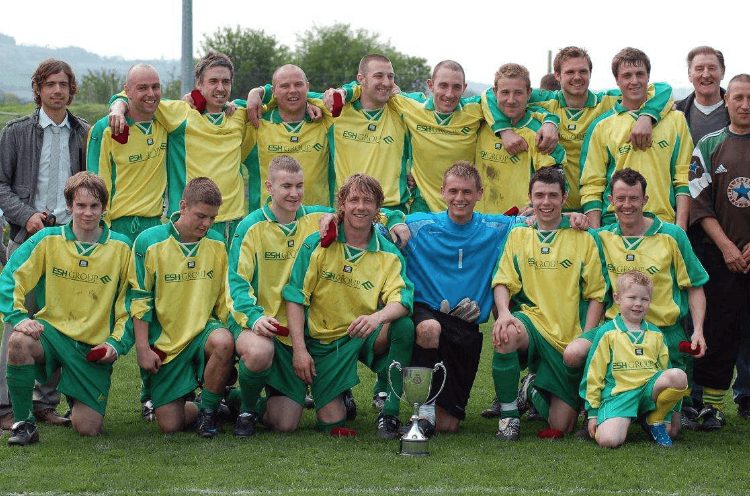 Esh Winning Football Club team photo with a trophy